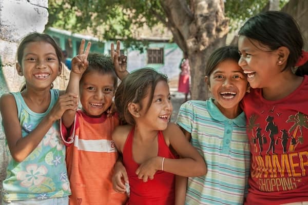 Children smiling in their community