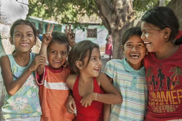 Children smiling in their community